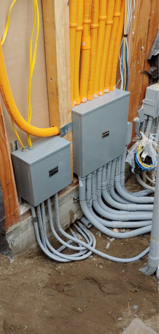 Commercial subpanels with organized PVC conduit runs and flexible conduit infrastructure installed by Burlingame Brothers Electric